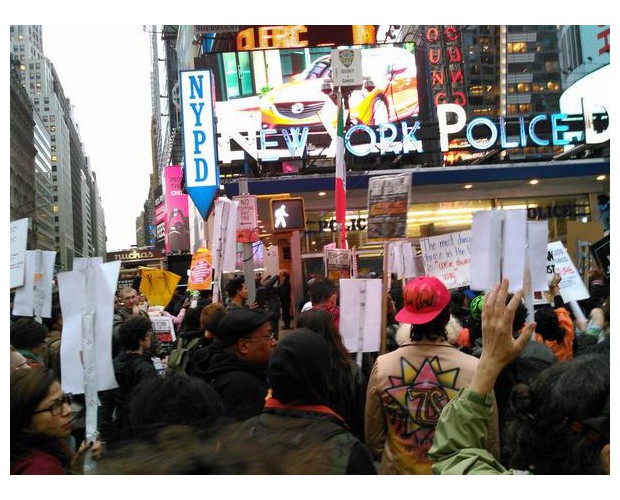 Over 500 people rallied and marched in NYC, including relatives of those murdered by police; here marchers reach Times Square—defying police threats and denial of permit.  Photo: Twitter/@BAEverywhere