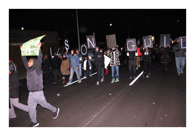 Protesters hold up letters that read 'WILSON GUILTY.'  Detroit, MI. Nov. 25, 2014. photo: Vallerie Jean