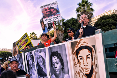 Rev. Frank Wulf speaking at a protest in from the LAPD headquarters on October 22 National Day of Protest to Stop Police Brutality, Repression and Criminalization of a Generation, 10/22/14. Photo: Special to Revolution