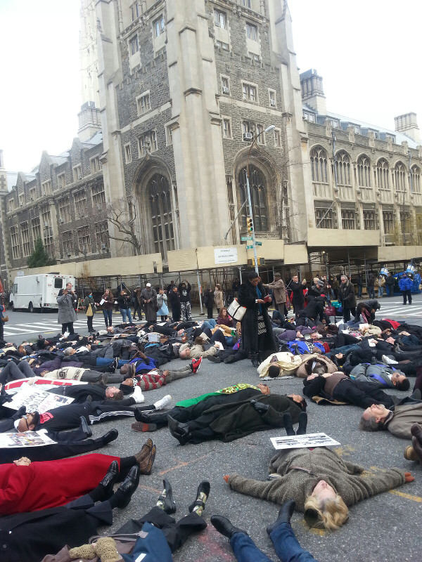 Clergy and others stage a die-in at the busy 120th and Broadway intersection in Manhattan, NYC December 18