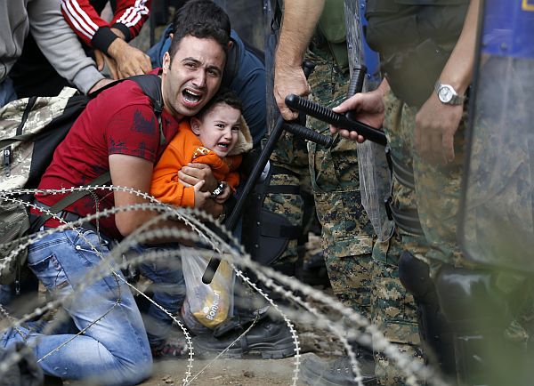 On August 21, photographer Georgi Licovski documented a brutal attack on migrants attempting to get out of Greece, where they are subjected to hate and concentration camps. The migrants were heading towards hoped-for sanctuary in northern Europe. But as they attempted to cross the border from Greece into neighboring Macedonia, police there fired tear gas and stun grenades to drive them back into Greece. Licovski said babies, children, and mothers were among those gassed and beaten, and that families were split up in the chaos. “For the first time in my life,” he said, “I saw my colleagues—photographers and journalists—crying because of the situation.”