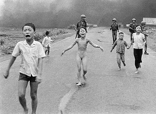 The United States carpet-bombed Vietnam, Cambodia, and Laos, in war for empire that led to the deaths of millions of innocent civilians in a declared aim to “bomb them back into the stone age.” Here, the horror after napalm was dropped on their village, June 1972. (Photo: AP)