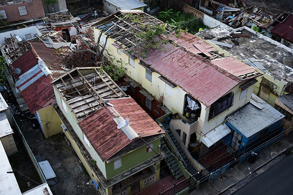 Sheets of zinc roofing blown off houses in Puerto Rico