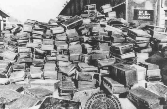 Suitcases that belonged to people deported to the Auschwitz camp. This photograph was taken after Soviet forces liberated the camp. Auschwitz, Poland, after January 1945.