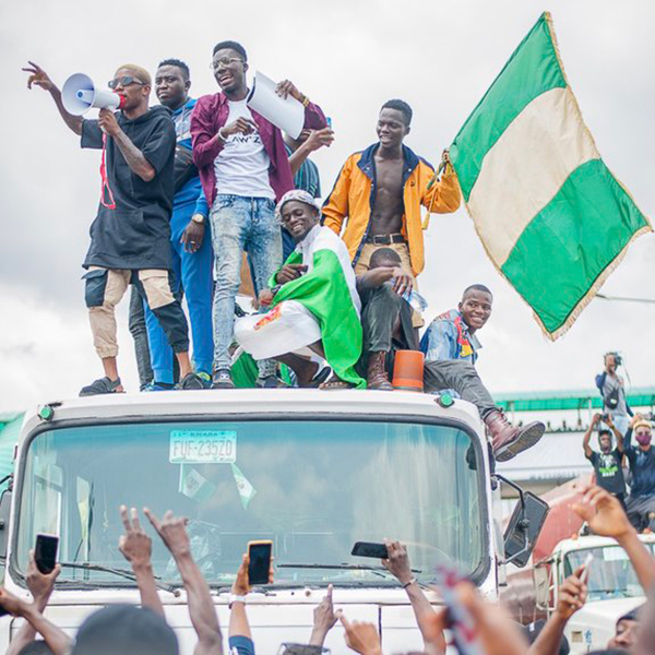 Kids on car with flags