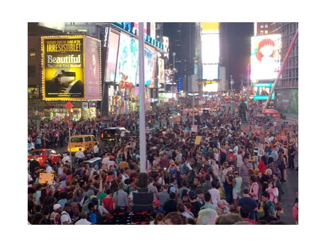 New York, Times Square, April 14. Thousands marched and hundreds sat down. Photo: AP