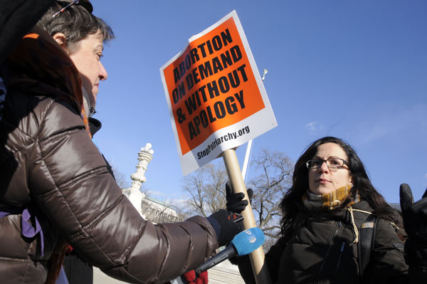 Sunsara Taylor being interviewed at Supreme Court, January 22, 2013, 40th anniversary of Roe v Wade . Photo: Li Onesto/Revolution