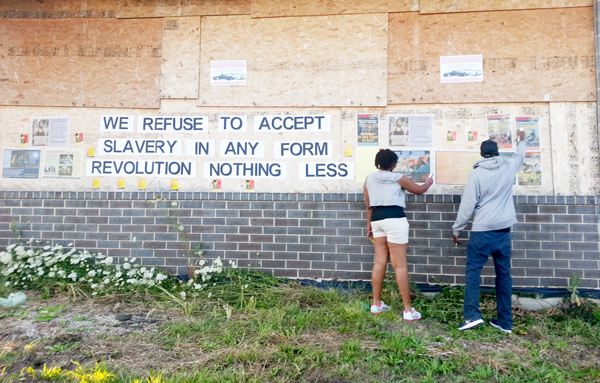 Chicago club members putting up revolutionary slogans 