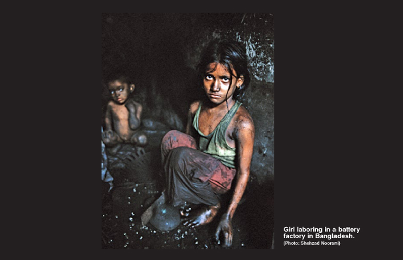 Girl laboring in a battery factory in Bangladesh