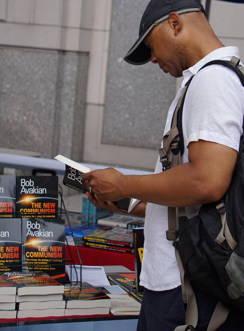 Man reading The New Communism