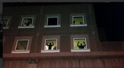 South Bay Prison in Boston as protesters call to them in front of the prison