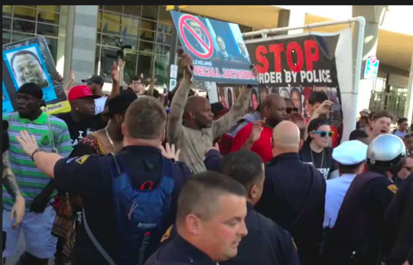 Police attack protesters Saturday, May 23 outside Quicken Loans Arena in Cleveland after a judge let the only cop charged in the police murder of Timothy Russell and Malissa Williams go free. Photo: special to revcom.us.