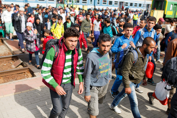 Migrants and refugees arrive at the railway station, southwest of Budapest, Hungary, near the Austrian border,  September 19.