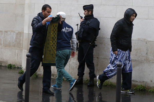 French police are stationed outside the Great Mosque of Paris.