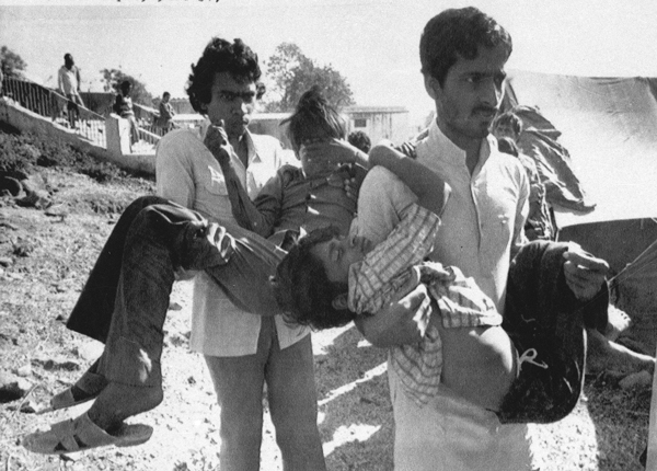 Children blinded by the poison gas leak at the Bhopal, India Union Carbide plant in 1984 are carried to a hospital.