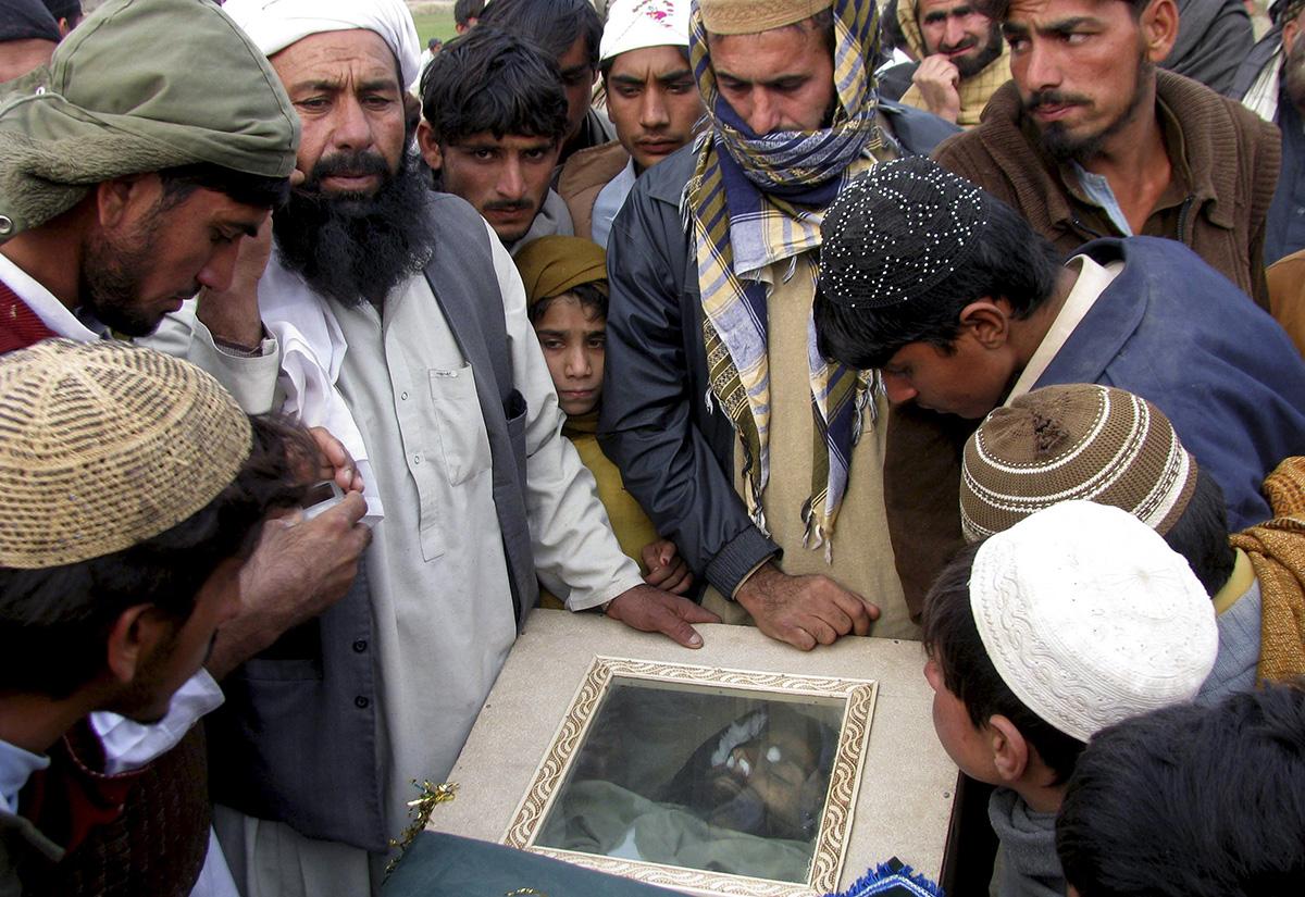 Pakistanis examine bodies of those killed by U.S. drone.