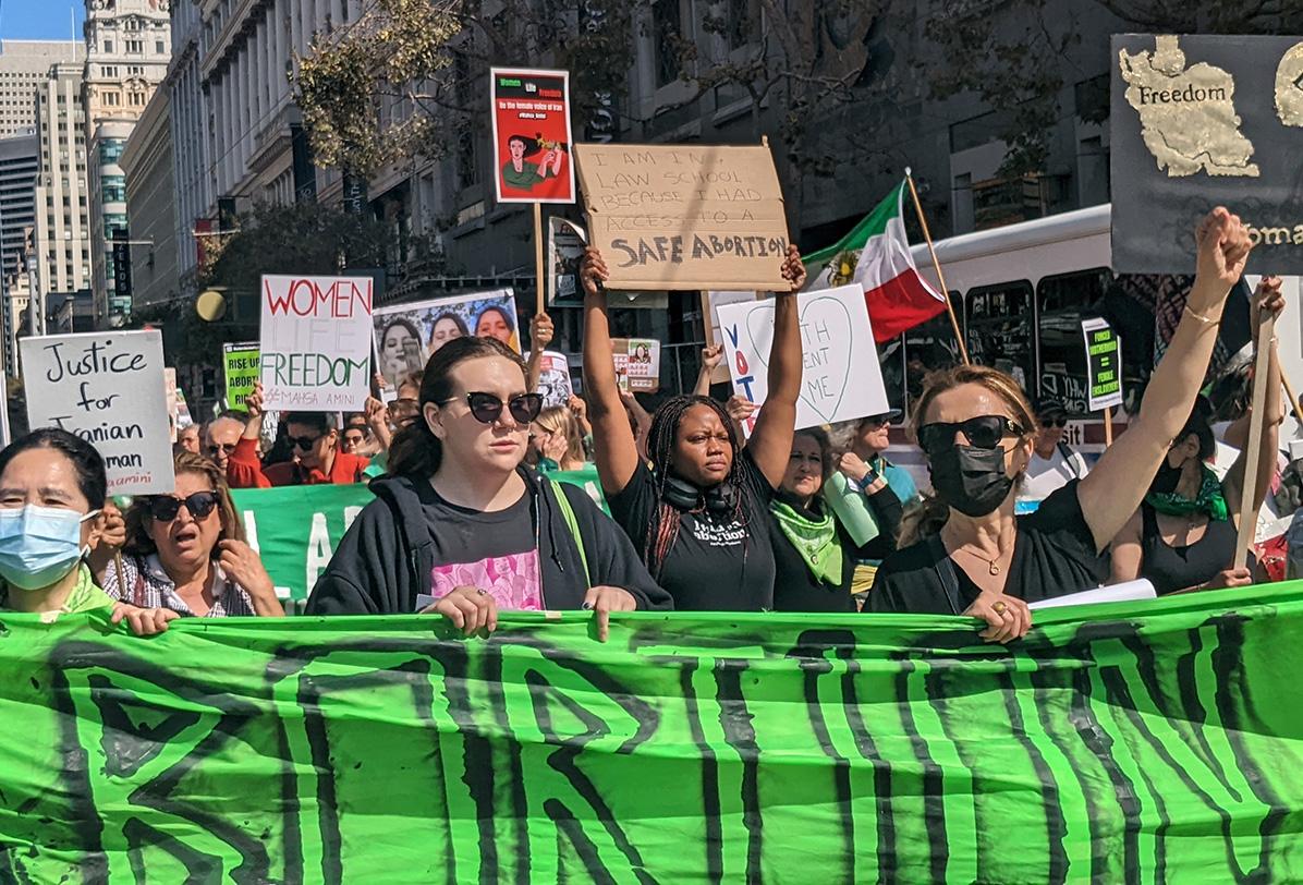 October 8, 2022, women's march in San Francisco takes over Market Street behind banner, Abortion on Demand, Without Apology. 