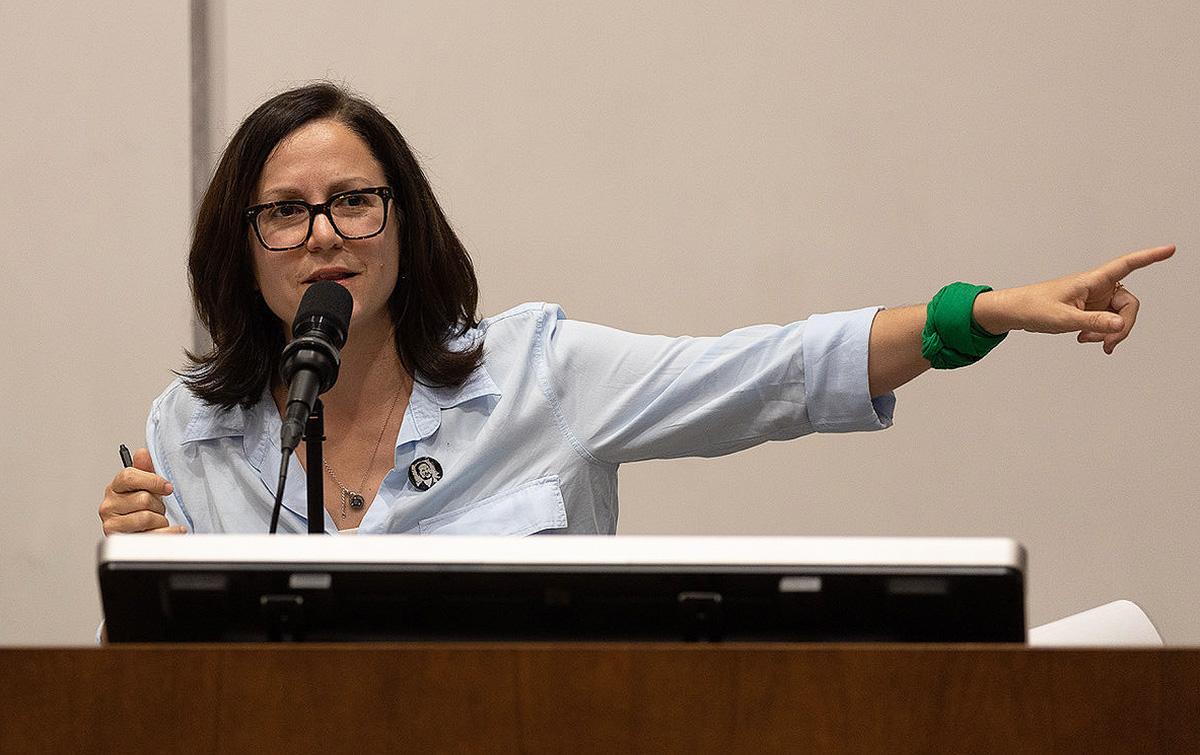 Sunsara Taylor points while speaking, "Woke Lunacy vs Real Revolution" talk at UCLA, May 25, 2023.