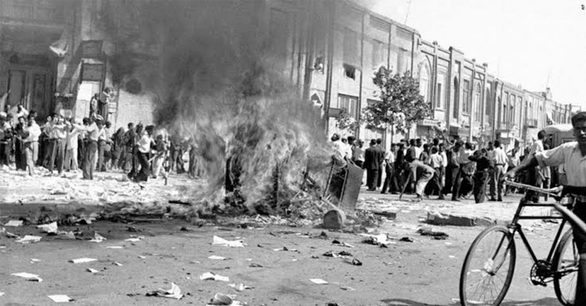 Mobs supporting the Shah burn office equipment of a communist newspaper, Tehran, 1953.