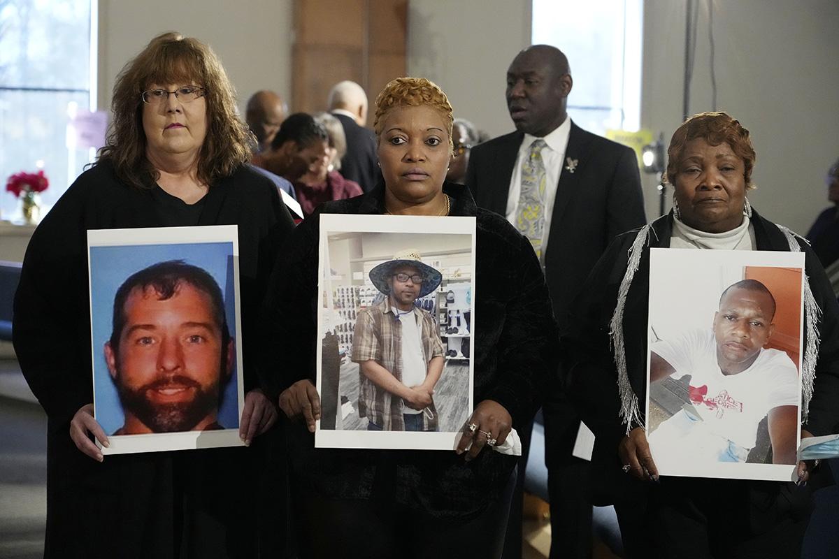 Three mothers hold pictures of their sons whose bodies were buried in unmarked graves without any notification.
