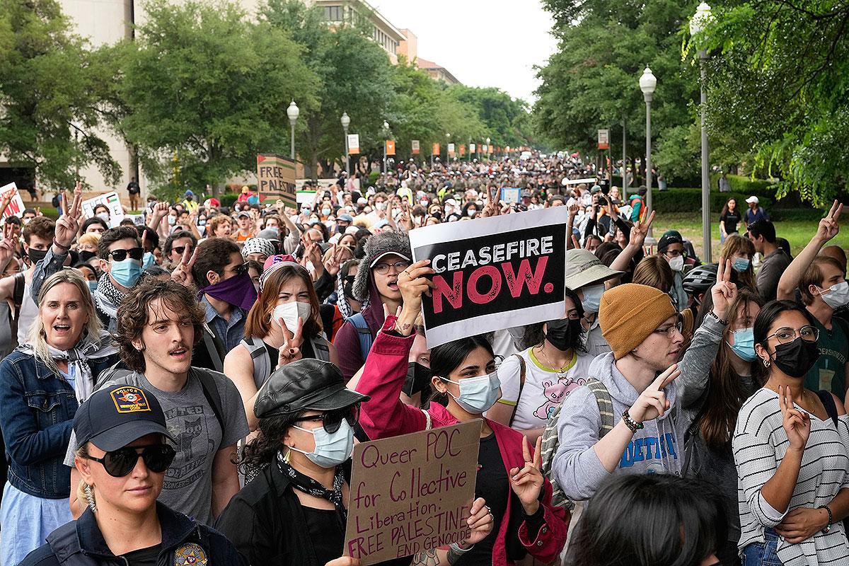 Pro-Palestinian protesters march at the University of Texas, Wednesday, April 24, 2024, in Austin, Texas.