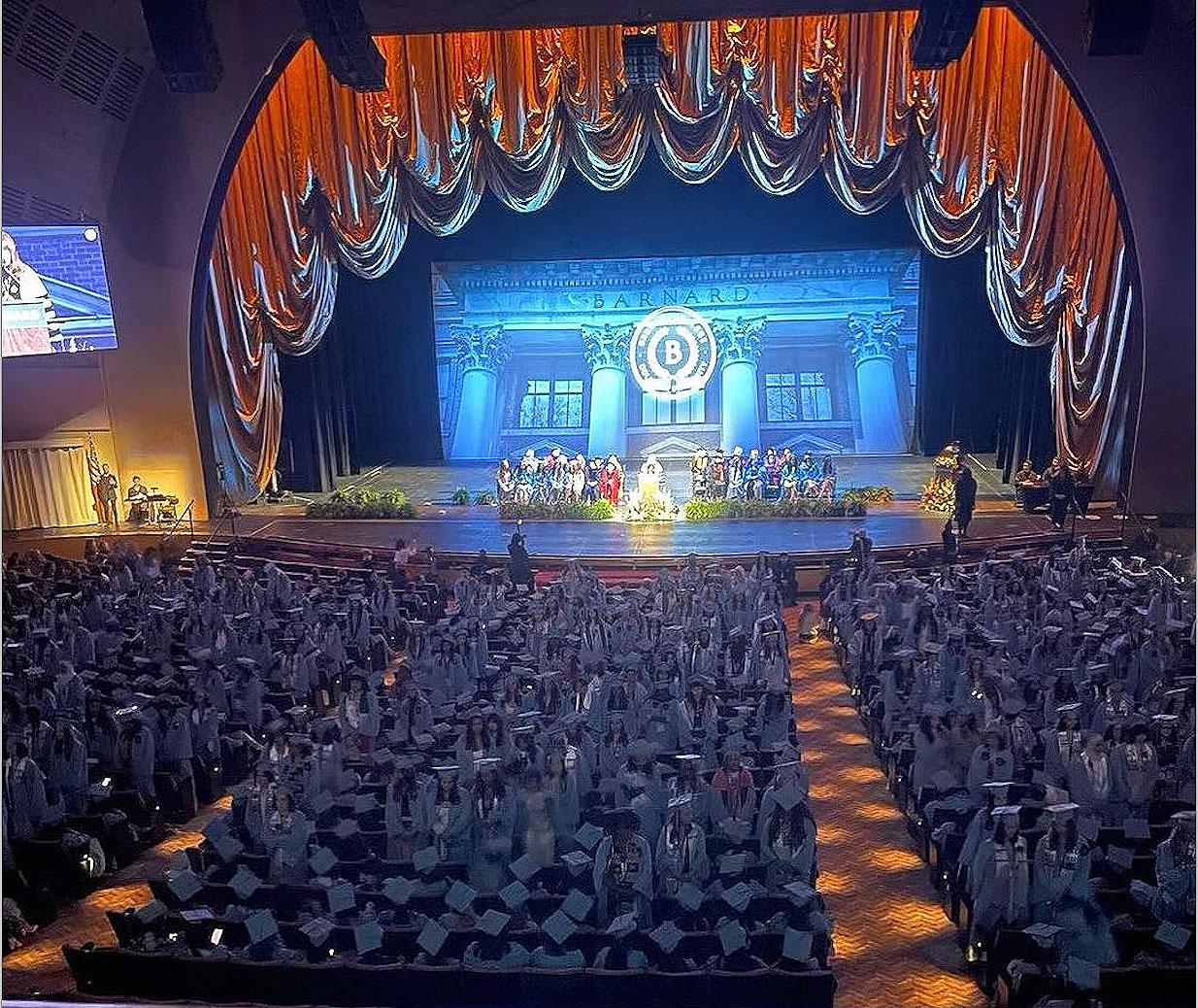 Barnard seniors stood and turned their backs to President Rosenbury and Dean Grinage as they spoke at Barnard graduation, May 15, 2024.