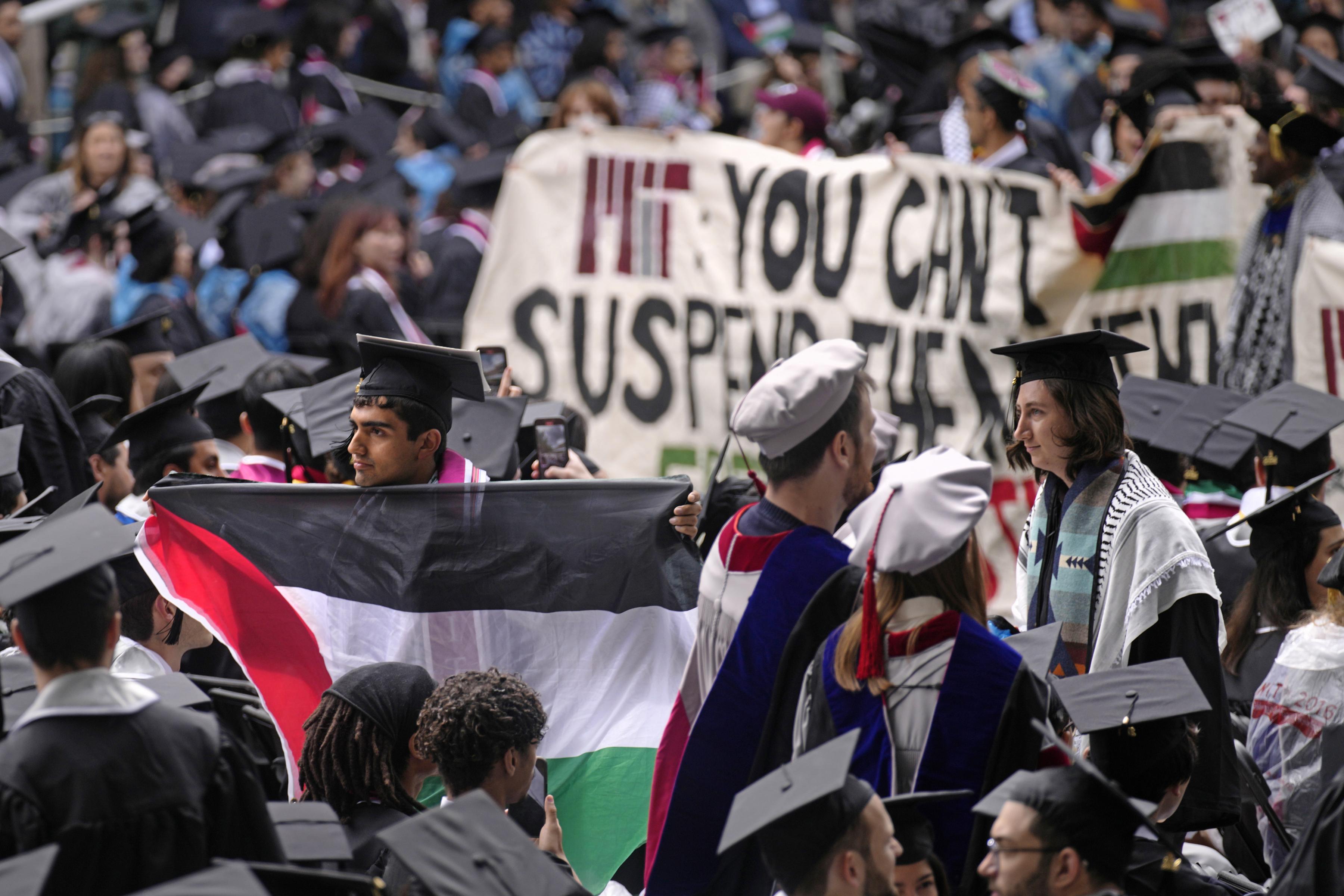 Walking out of commencement in protest at the Massachusetts Institute of Technology,