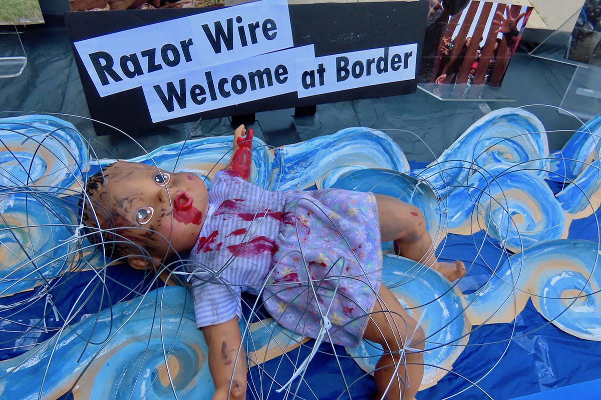 July 4, 2024, NYC: Art installation of baby in razorwire on the border.