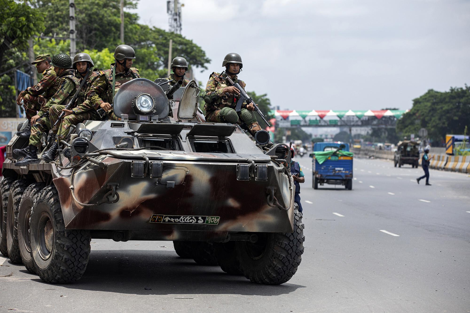 Bangladeshi army patrols in an armored vehicle the Dhaka-Chittagong highway, Dhaka, July 23, 2024.