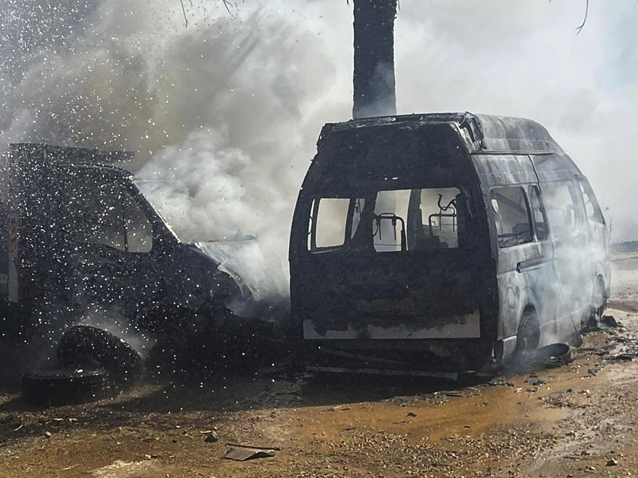 Truck and ambulance burn after Israeli airstrikes hit a group of paramedics outside a hospital in Marjayoun, south Lebanon, October 4, 2024.