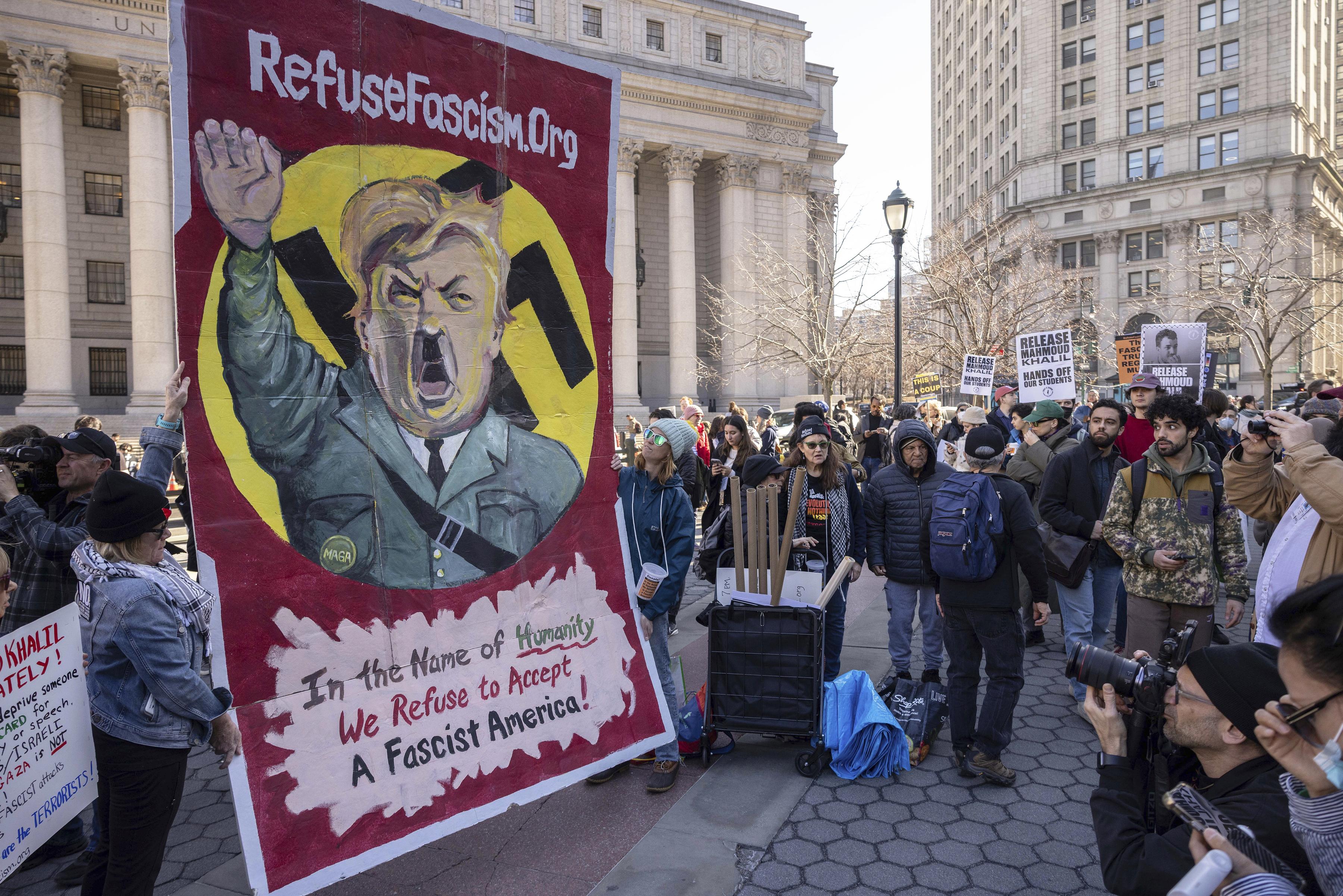 Protest for Palestinian activist Mahmoud Khalil with large poster of Trump/Hitler, March 10, 2025, in New York.