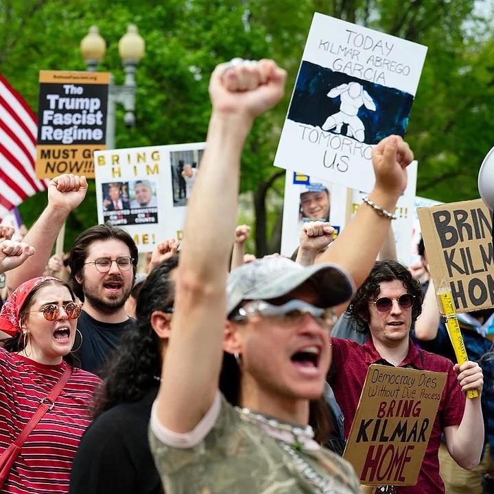 Crowd of protesters with fists in the air
