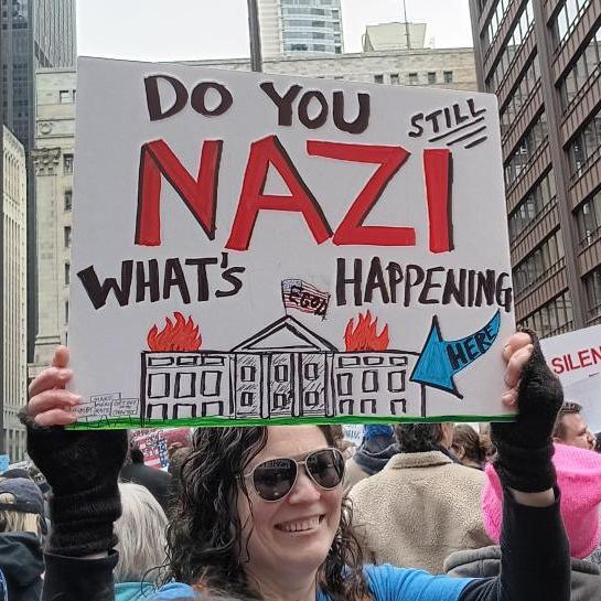 Protest in Chicago on April 5 2025. Sign says "Do you NAZI what's happening?"