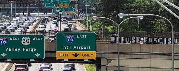 Refuse Fascism banner over freeway in Philadelphia