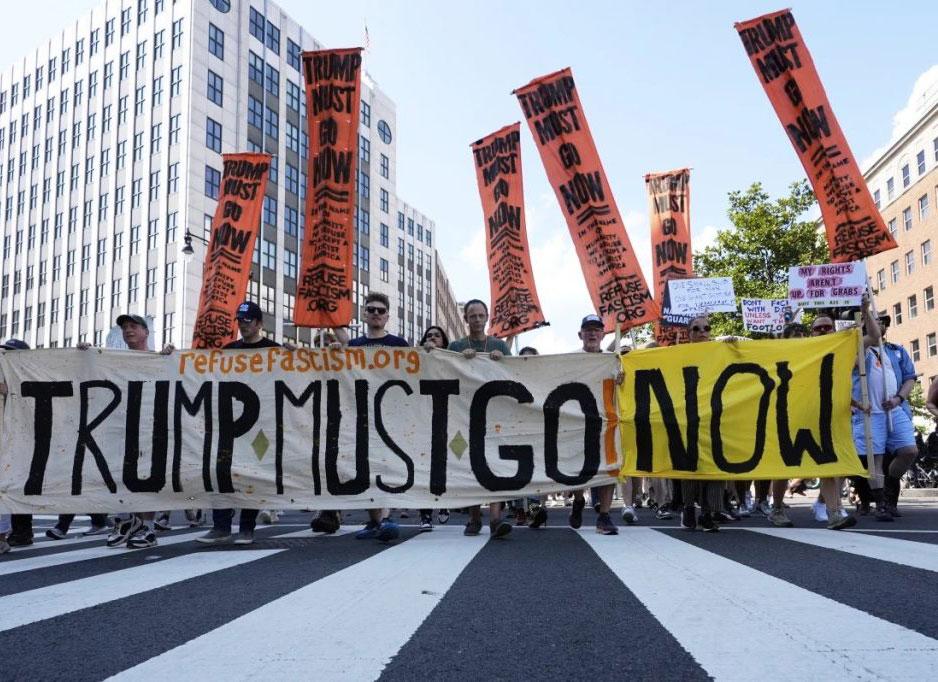 Refuse Fascism banner leads march in Washinton DC, August 16, 2025