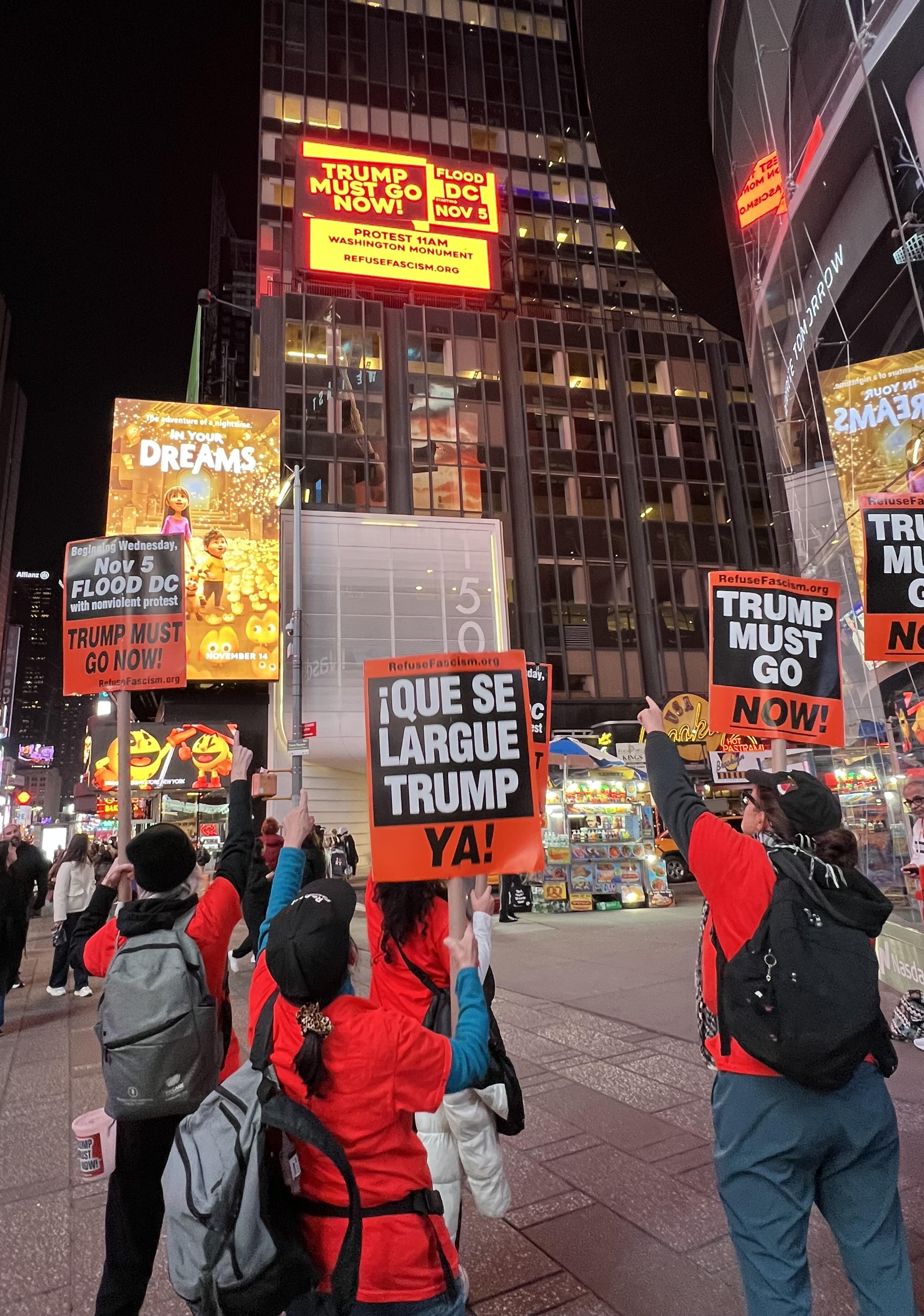 Refuse Fascism billboard lights up Times Square.
