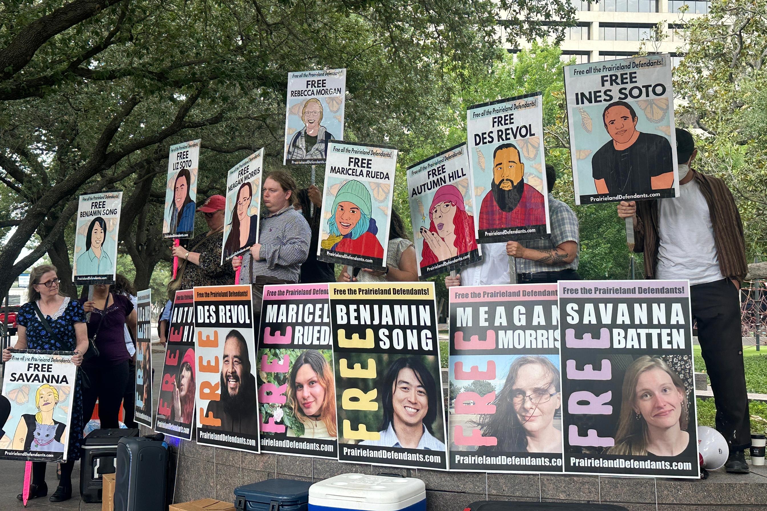 Supporters with signs for defendants convicted in Immigration detention center shooting case, Fort Worth, Texas, June 23, 2026.