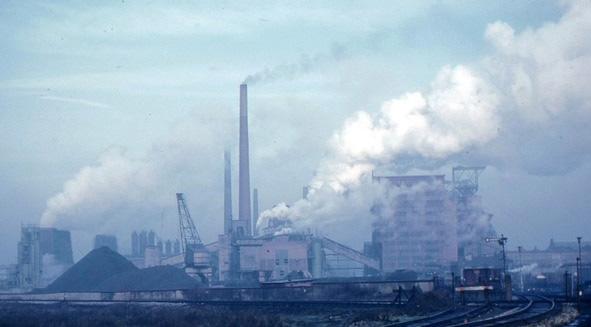 CO2 emissions/pollution from smokestacks at coal power plant.