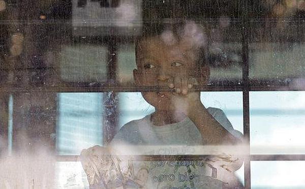 Immigrant child separated from parents on bus in McAllen, Texas, 2018.