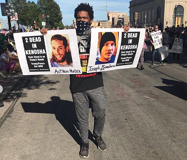 Protest with pictures of Rosenbaum and Huber murdered by Rittenhouse in Kenosha.