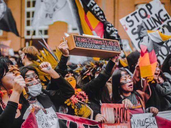 Amazonian youth from Brazil and Ecuador protesting in Glasgow
