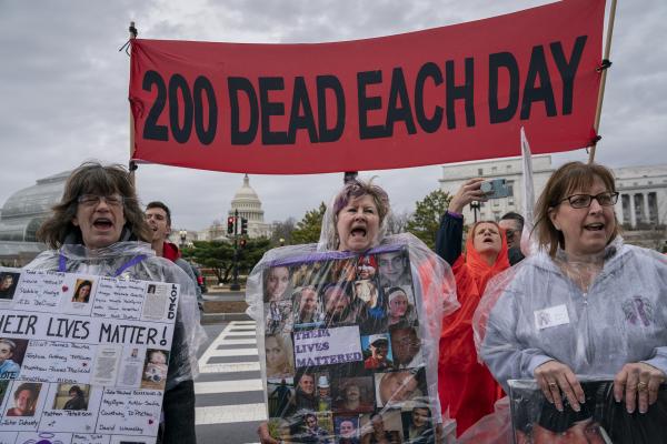 Protesting opioids in Washington, DC with sign 200 dead each day.