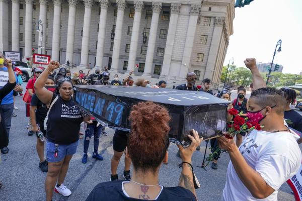 Protesters, including Akeem Browder, carry mock casket for Kalief Browder, demand shut down Rikers Island.