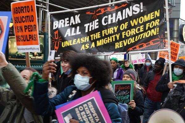 Break All the Chains banner in the New York City IWD RiseUp4AbortionRights march.