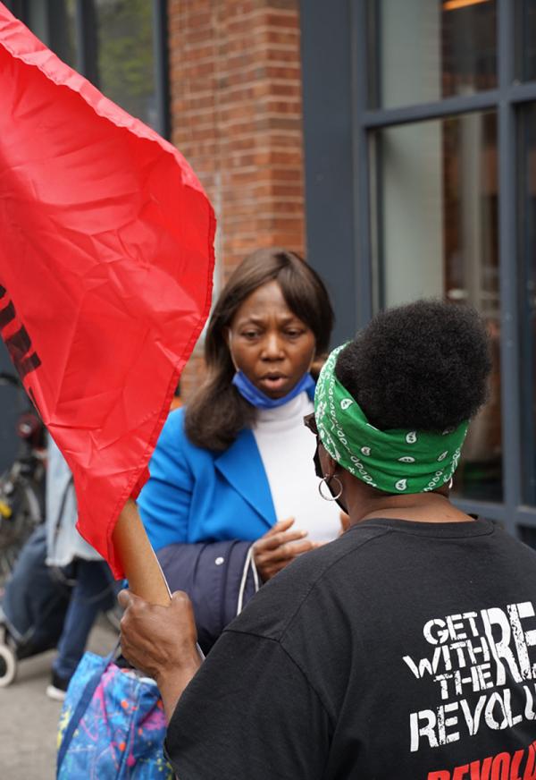 Leafletting during May Day rally in New York City.