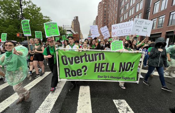 New York City spirited march for RU4AR with banner "Overturn Roe? Hell No!"