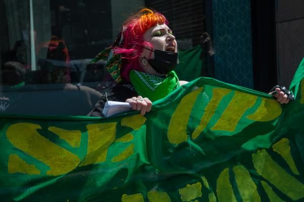 San Francisco: Woman with banner for RiseUp4AbortionRights.