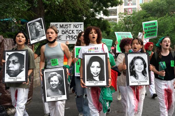 New York City RU4AR students hold signs of victims at Union Square.