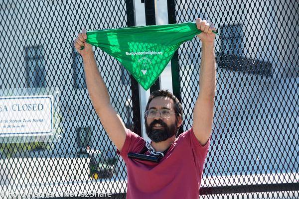 Guido Reichstadter waves abortion rights green bandana at Supreme Court, June 6.