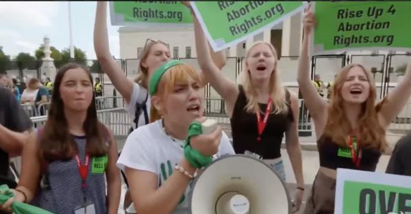 Young women in front of SCOTUS